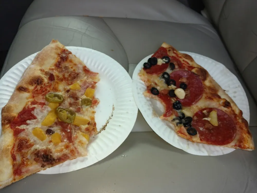 We Already Ate Half of These Giant Slices of Pizza